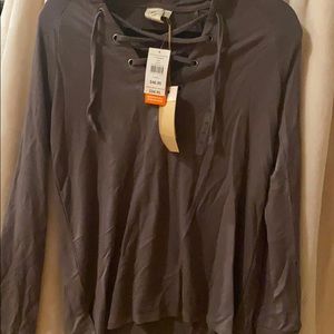 Long sleeve gray shirt.